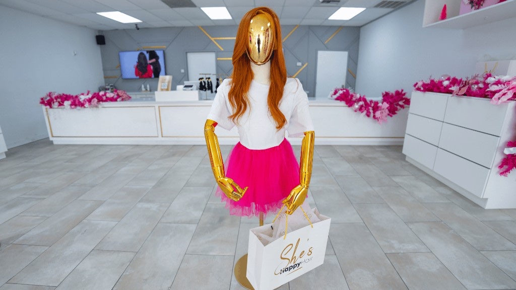 Center floor mannequin with shopping bag at Houston North