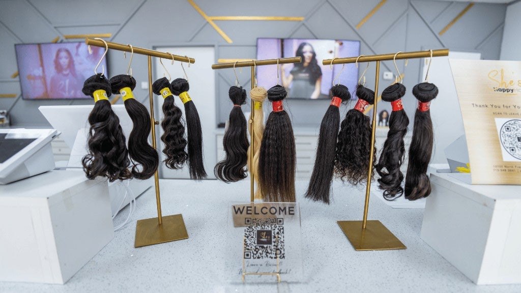 Close-up of hair products and stands on the Houston North counter