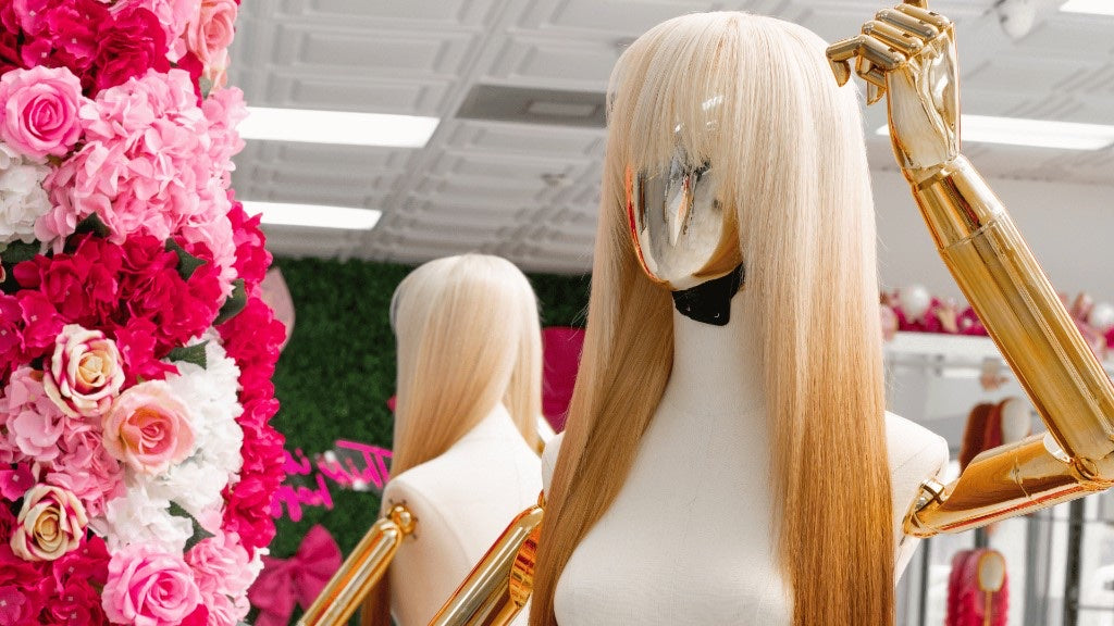 Blonde mannequin close-up by floral frame at Houston South